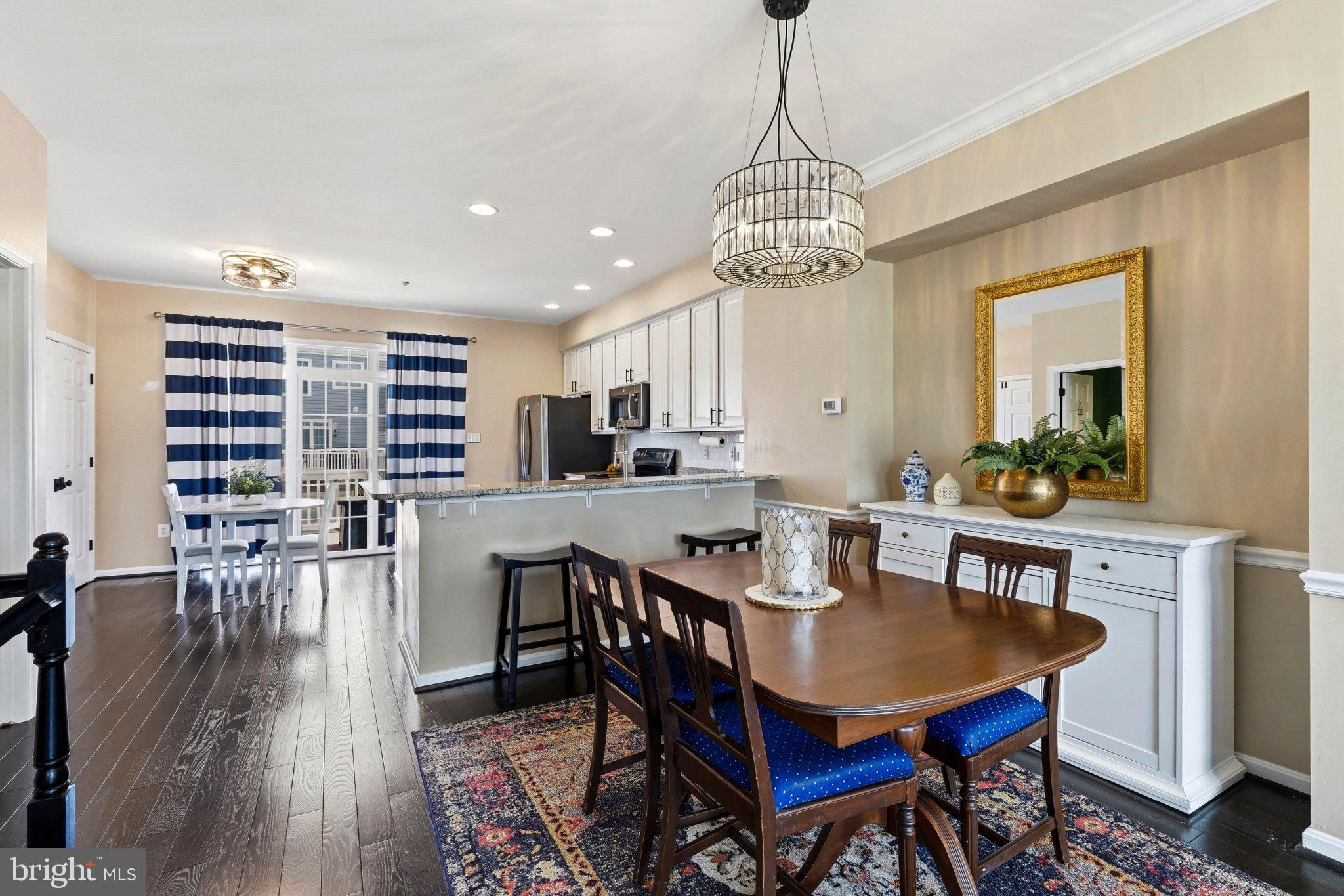 2668 Merlin Court Odenton, MD 21113 - Photo 5 of 42 a view of a dining room with furniture window and wooden floor