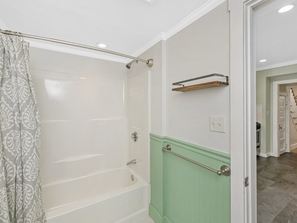 89 Green Street Wakefield, MA 01880 - Photo 11 of 38 a bathroom with a shower and a bath tub