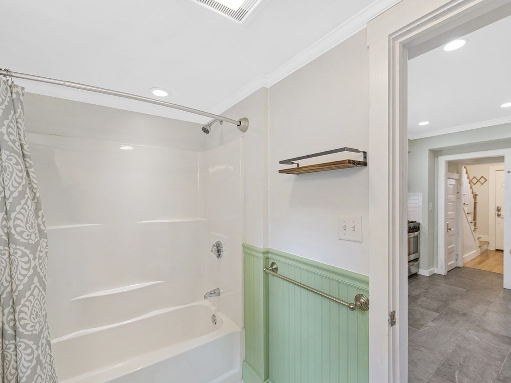 89 Green Street Wakefield, MA 01880 - Photo 12 of 38 a bathroom with a shower and a tub