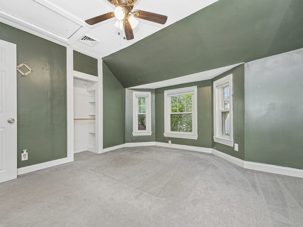 89 Green Street Wakefield, MA 01880 - Photo 14 of 38 an empty room with windows and fan