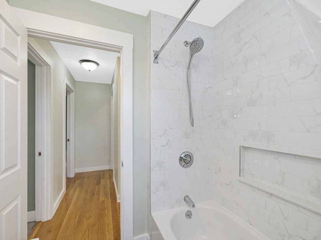 89 Green Street Wakefield, MA 01880 - Photo 22 of 38 a bathroom with a tub and shower