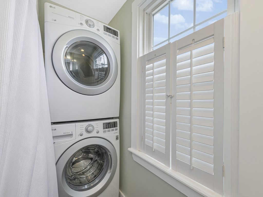 89 Green Street Wakefield, MA 01880 - Photo 23 of 38 a view of a hallway with washer and dryer