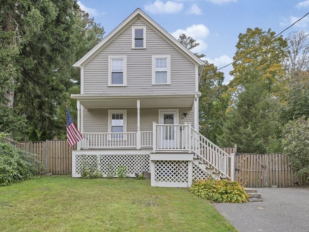 89 Green Street Wakefield, MA 01880 - Photo 24 of 38 a front view of a house with a garden