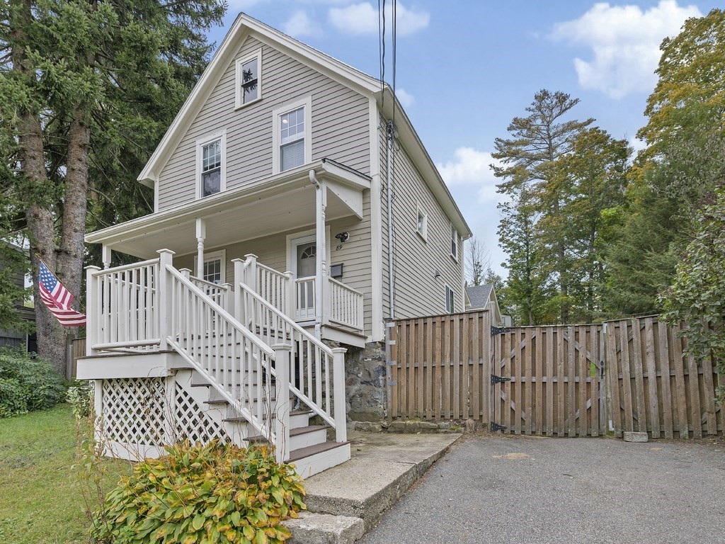 89 Green Street Wakefield, MA 01880 - Photo 25 of 38 a front view of a house with a garden