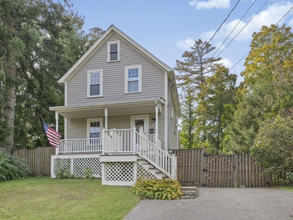 89 Green Street Wakefield, MA 01880 - Photo 26 of 38 a front view of a house with a garden