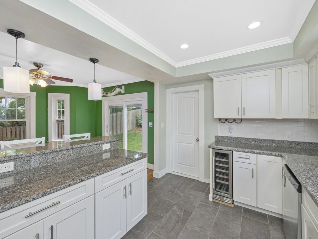 89 Green Street Wakefield, MA 01880 - Photo 3 of 38 a open kitchen with granite countertop a sink and a stove top oven