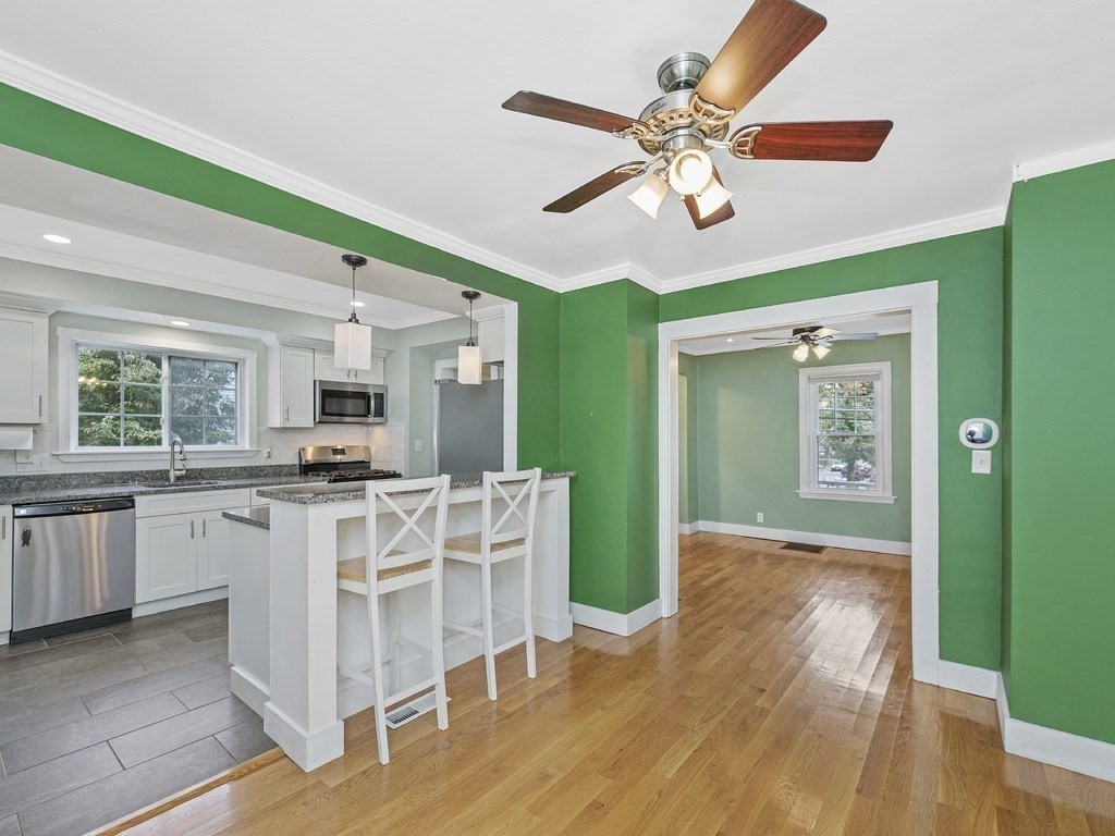 89 Green Street Wakefield, MA 01880 - Photo 4 of 38 a view of a kitchen with sink and microwave