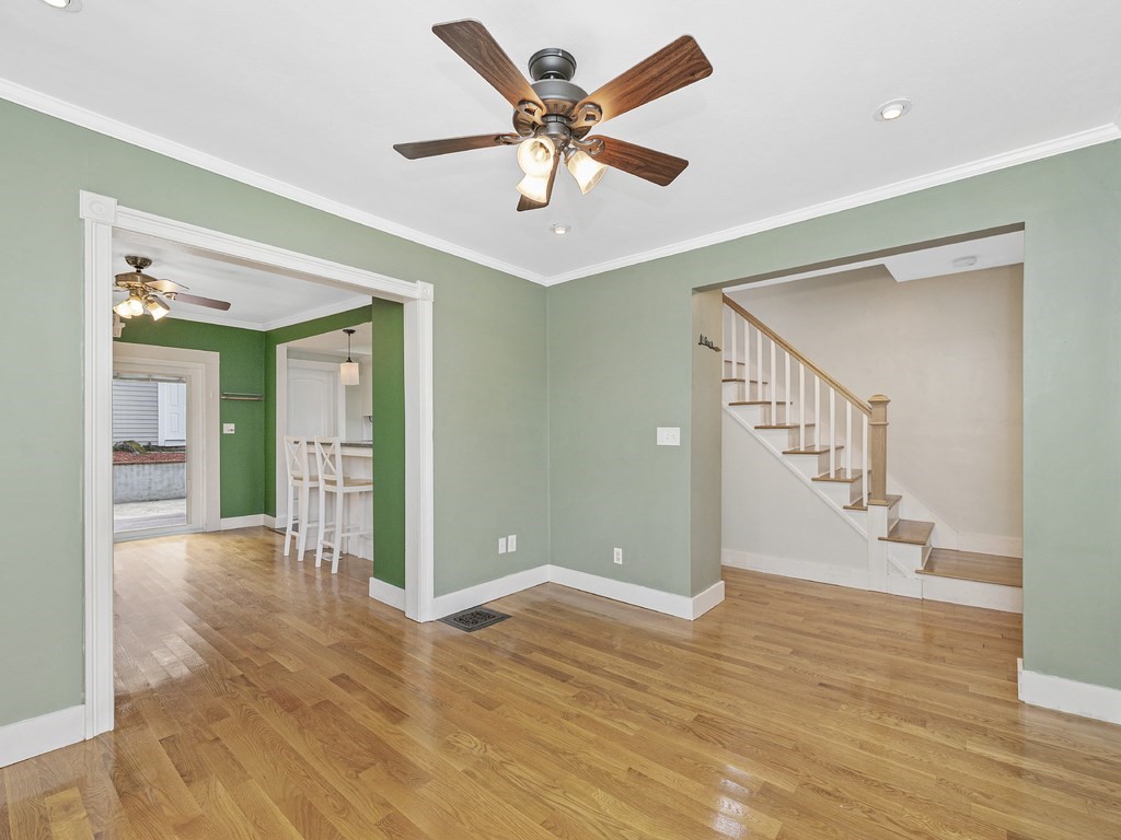 89 Green Street Wakefield, MA 01880 - Photo 6 of 38 a view of an empty room with window and wooden floor