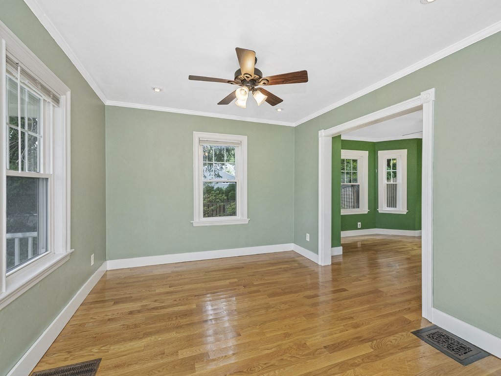 89 Green Street Wakefield, MA 01880 - Photo 7 of 38 a view of empty room with wooden floor and fan
