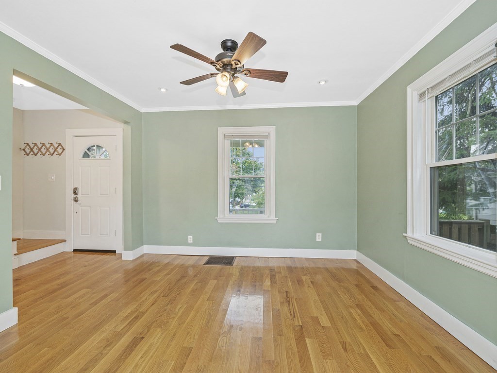 89 Green Street Wakefield, MA 01880 - Photo 8 of 38 a view of empty room with wooden floor and window