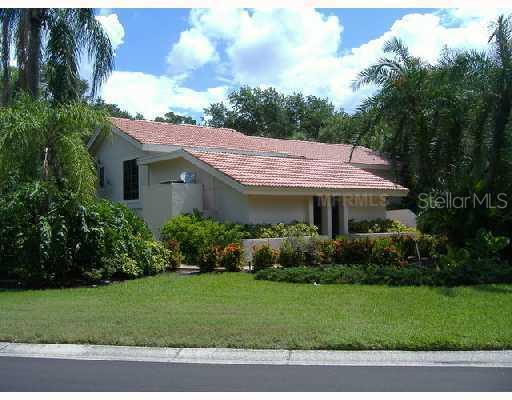 3360 Bayou Gate Longboat Key, FL 34228 - Photo 1 of 1 Exterior Front - Home tucked away amongst lush, tropical foliage.