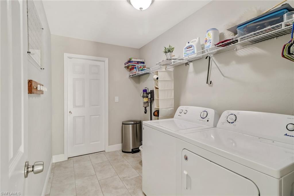 4355 Pine Ridge Road Naples, FL 34119 - Photo 14 of 23 a utility room with dryer and washer