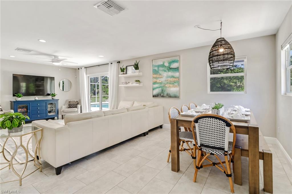 4355 Pine Ridge Road Naples, FL 34119 - Photo 17 of 23 a living room with furniture and a window