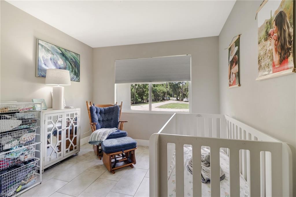 4355 Pine Ridge Road Naples, FL 34119 - Photo 7 of 23 a living room with furniture and a window