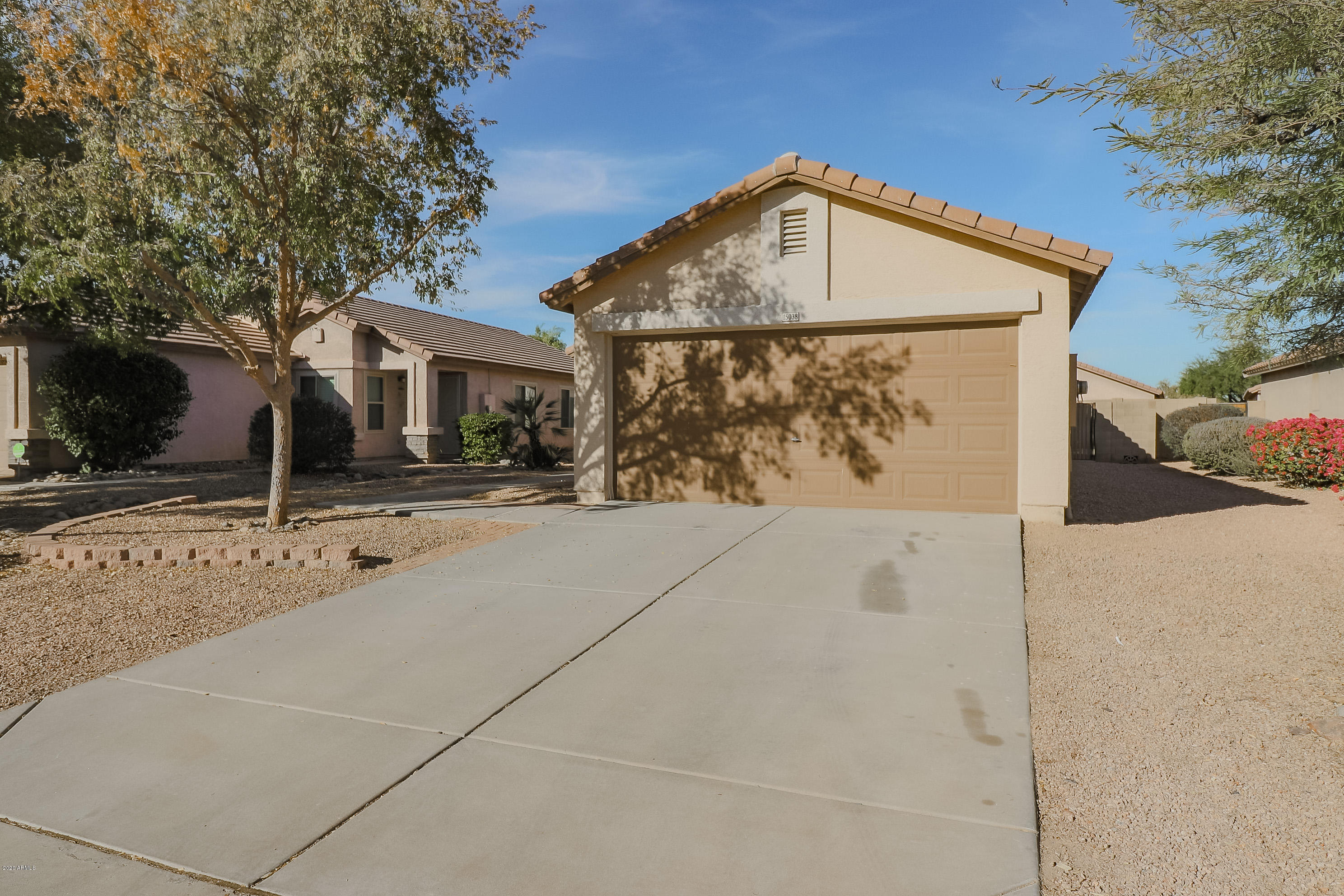 15038 West Redfield Road Surprise, AZ 85379 - Photo 4 of 21 a front view of a house with a yard