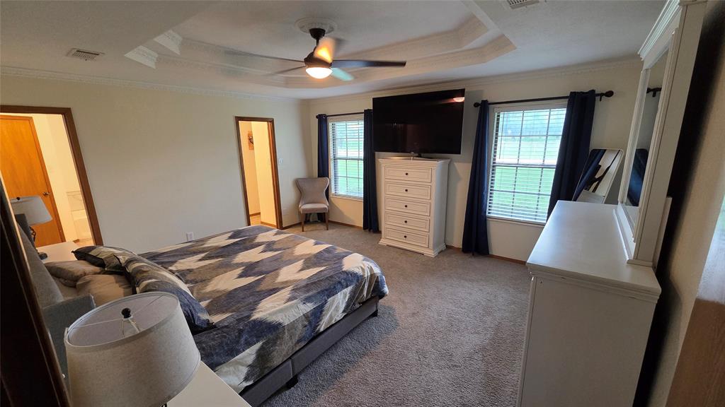 338 Travis Road Decatur, TX 76234 - Photo 20 of 40 a bed room with a bed window and a television