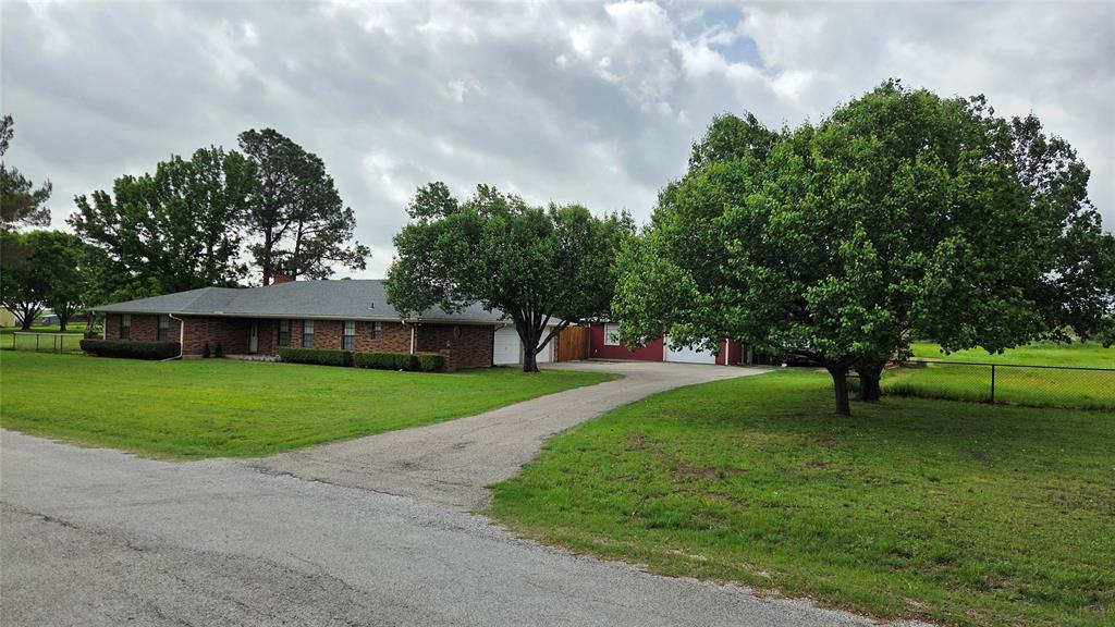 338 Travis Road Decatur, TX 76234 - Photo 2 of 40 a view of a house with a yard
