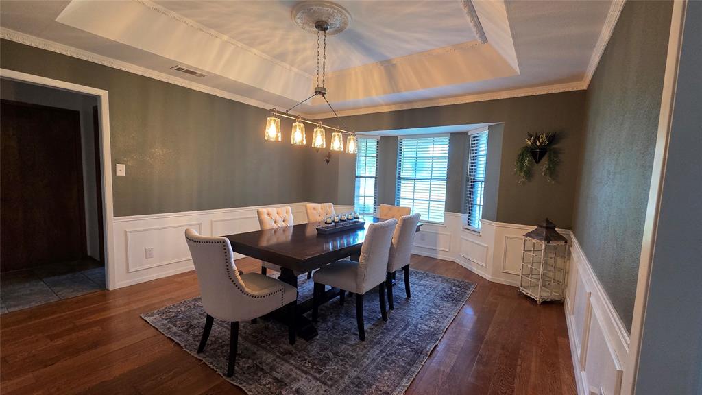 338 Travis Road Decatur, TX 76234 - Photo 28 of 40 a view of a dining room with furniture and wooden floor