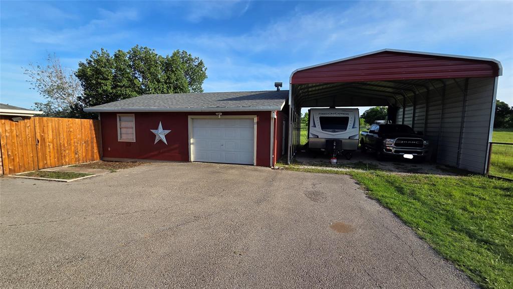 338 Travis Road Decatur, TX 76234 - Photo 32 of 40 a view of a house with a yard