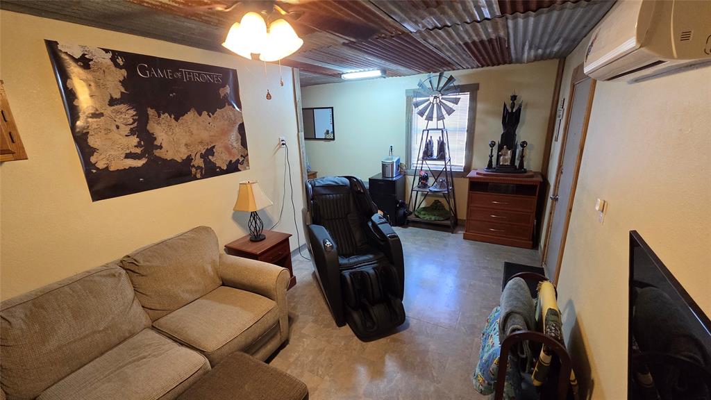 338 Travis Road Decatur, TX 76234 - Photo 36 of 40 a living room with furniture and wooden floor