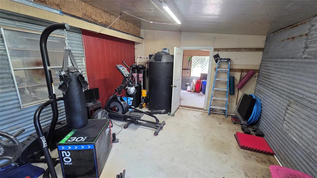 338 Travis Road Decatur, TX 76234 - Photo 40 of 40 a view of a room with gym equipment
