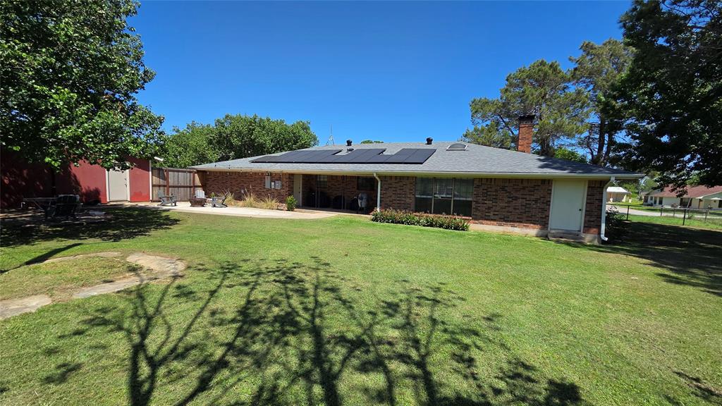 338 Travis Road Decatur, TX 76234 - Photo 4 of 40 a front view of a house with garden