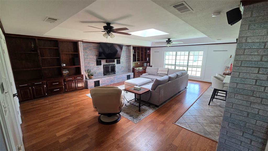 338 Travis Road Decatur, TX 76234 - Photo 7 of 40 a living room with furniture and a flat screen tv