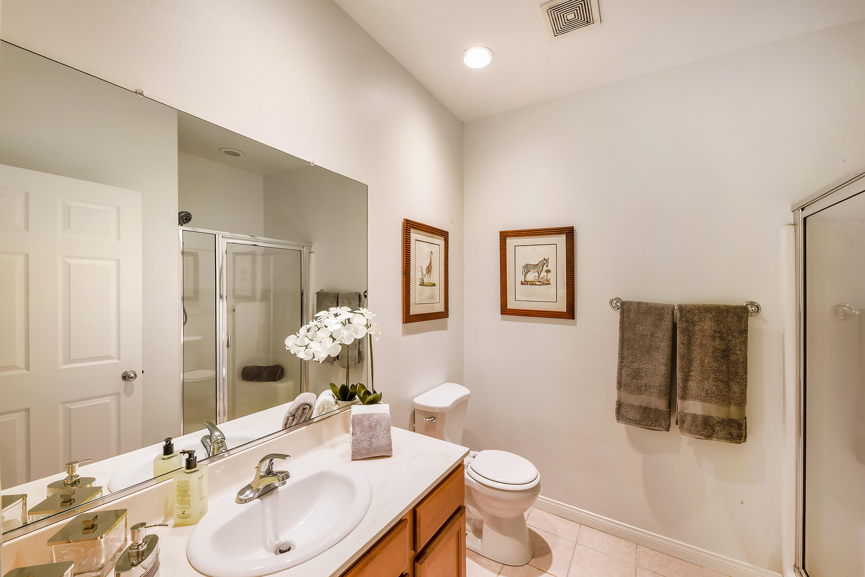 82346 Lancaster Way, Unit 125 Indio, CA 92201 - Photo 14 of 34 a bathroom with a sink toilet and shower