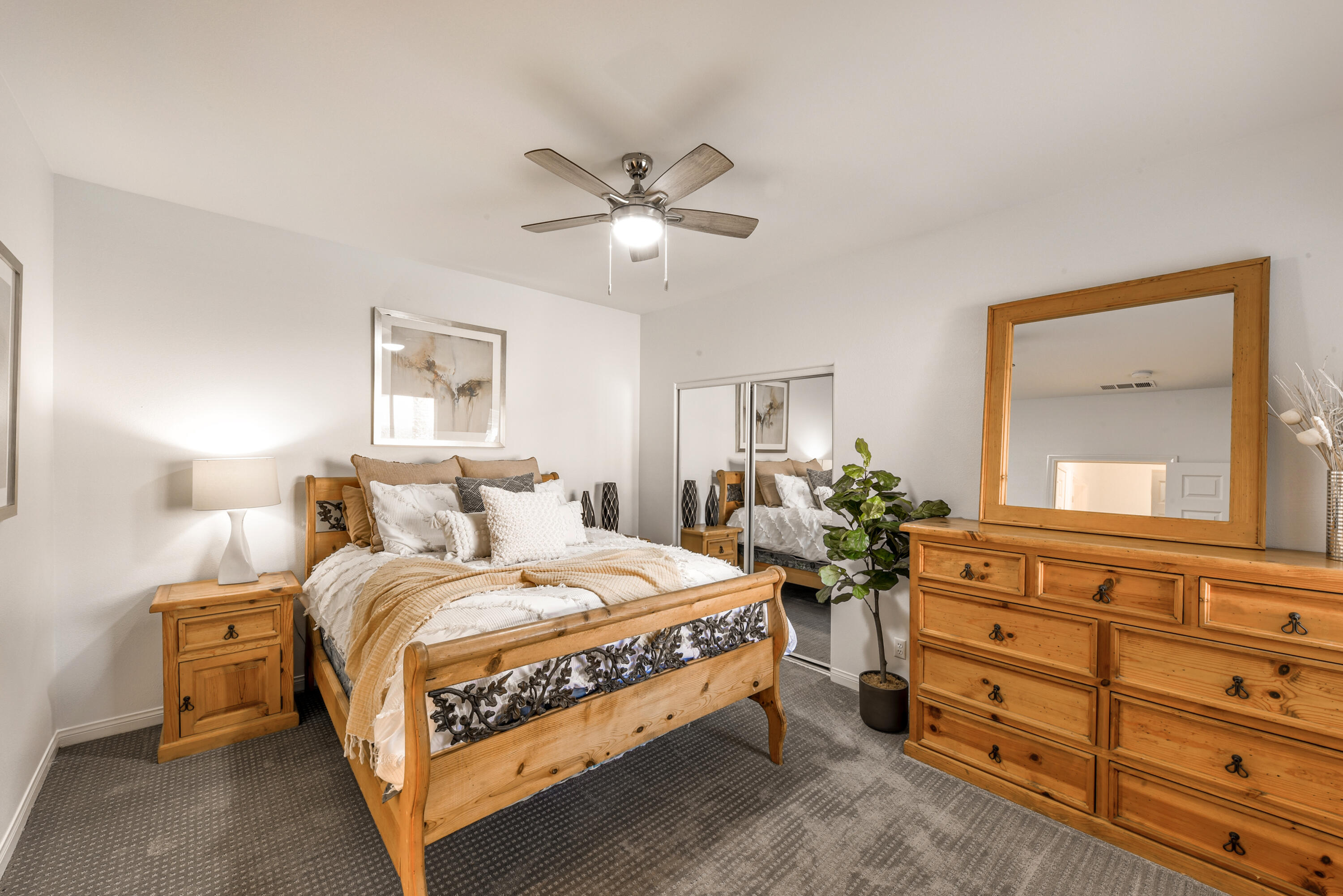 82346 Lancaster Way, Unit 125 Indio, CA 92201 - Photo 15 of 34 a bedroom with a bed and ceiling fan