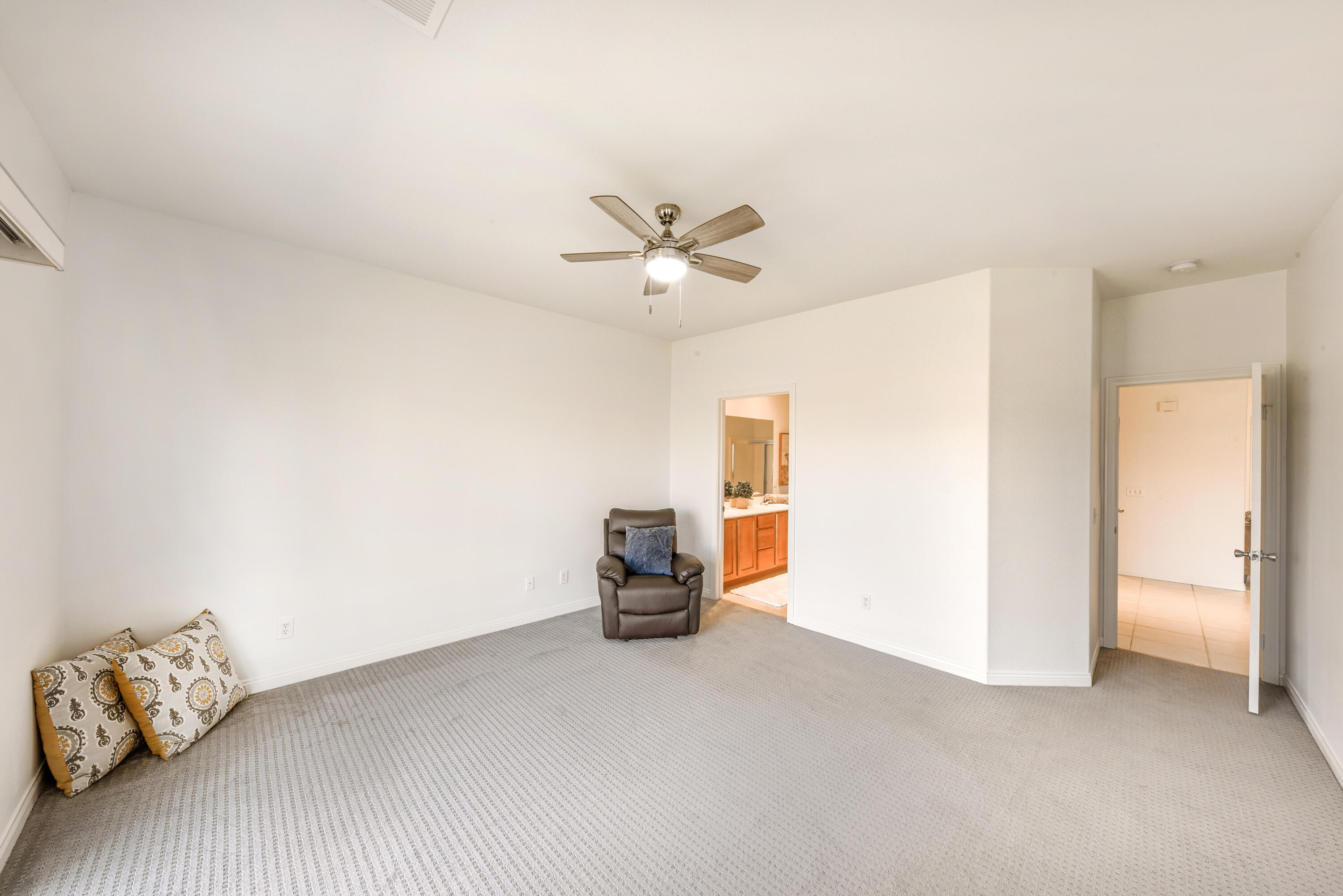 82346 Lancaster Way, Unit 125 Indio, CA 92201 - Photo 18 of 34 a living room with furniture and a chandelier