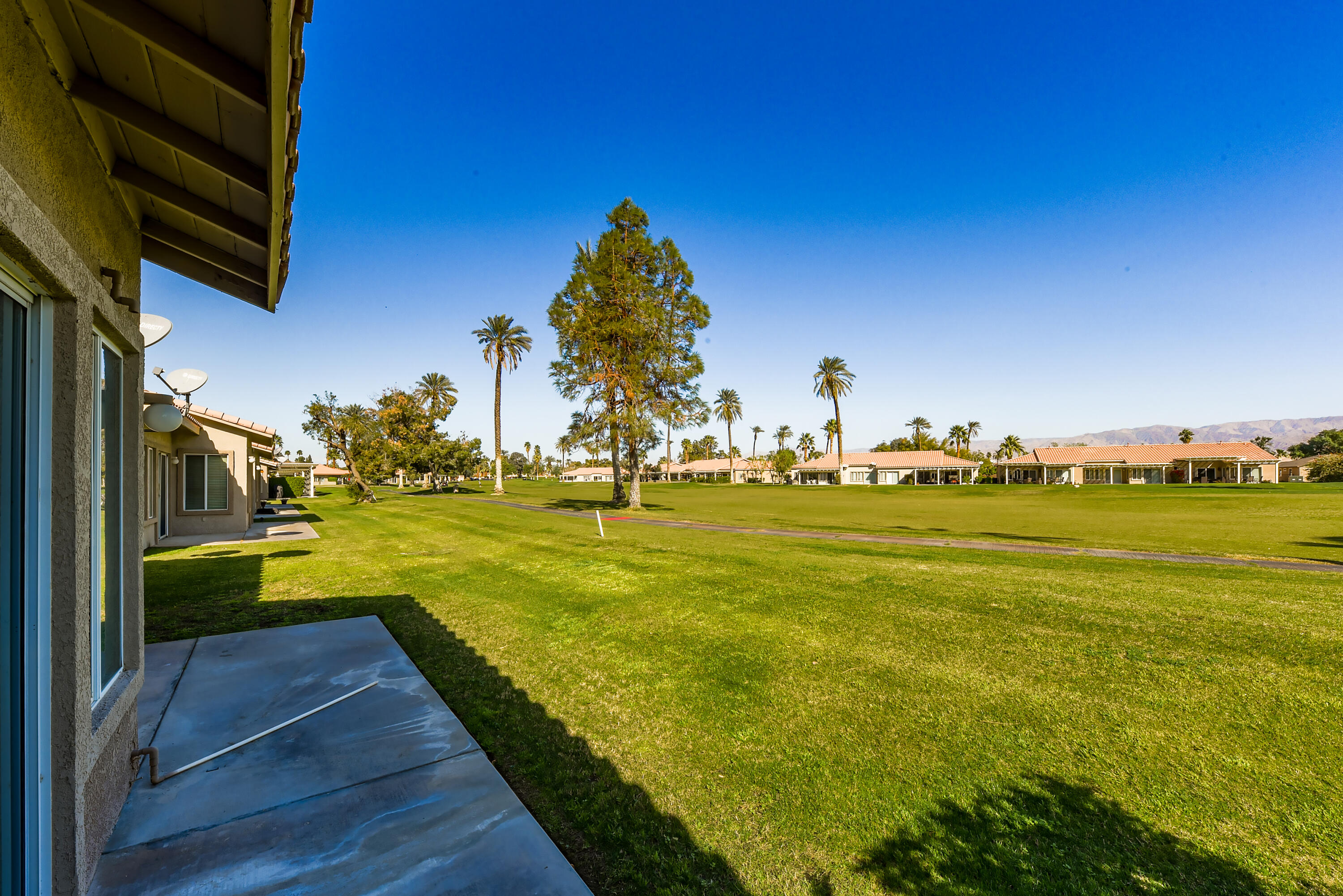 82346 Lancaster Way, Unit 125 Indio, CA 92201 - Photo 23 of 34 a view of an swimming pool and an outdoor space