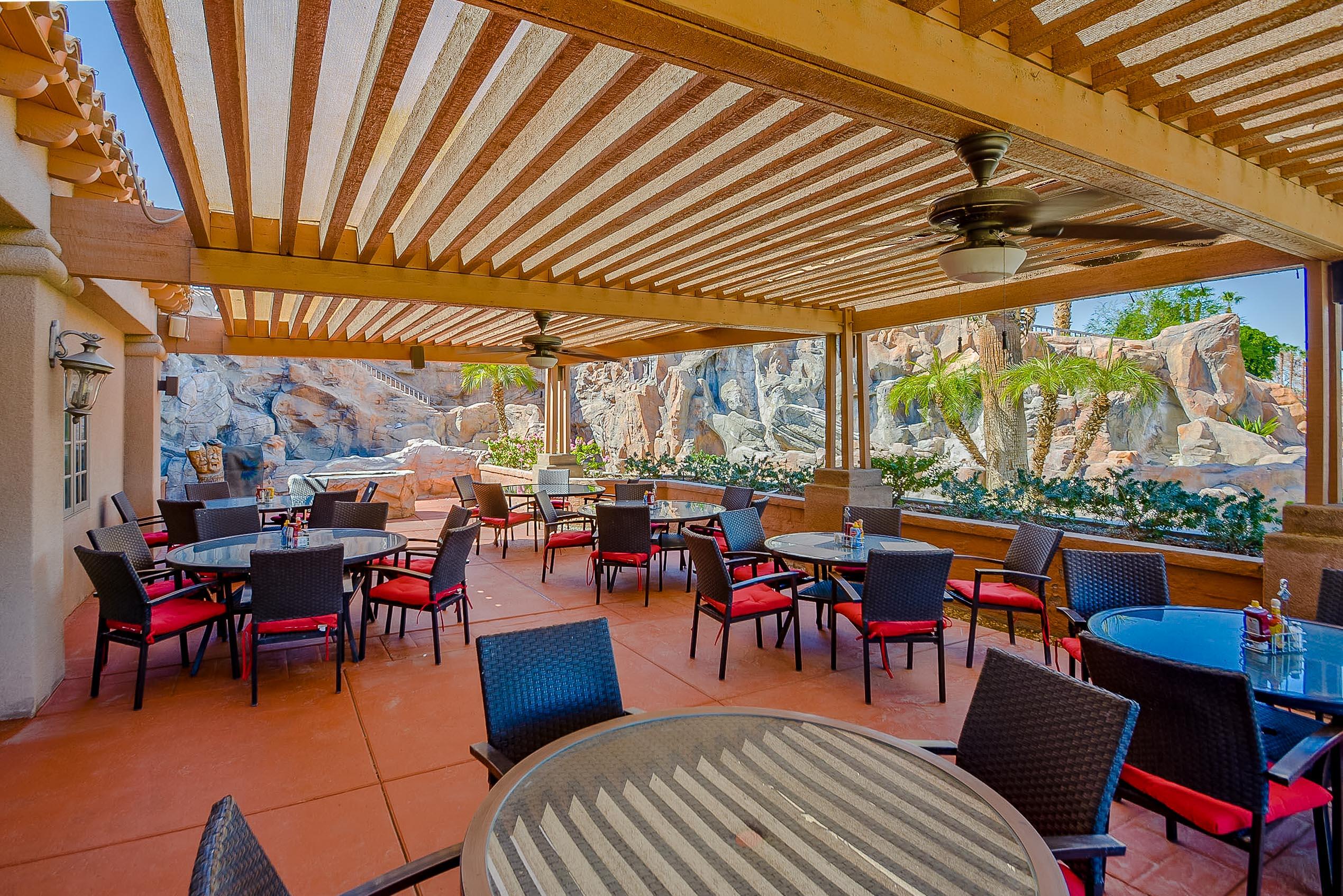 82346 Lancaster Way, Unit 125 Indio, CA 92201 - Photo 32 of 34 a outdoor space with lots of tables and chairs