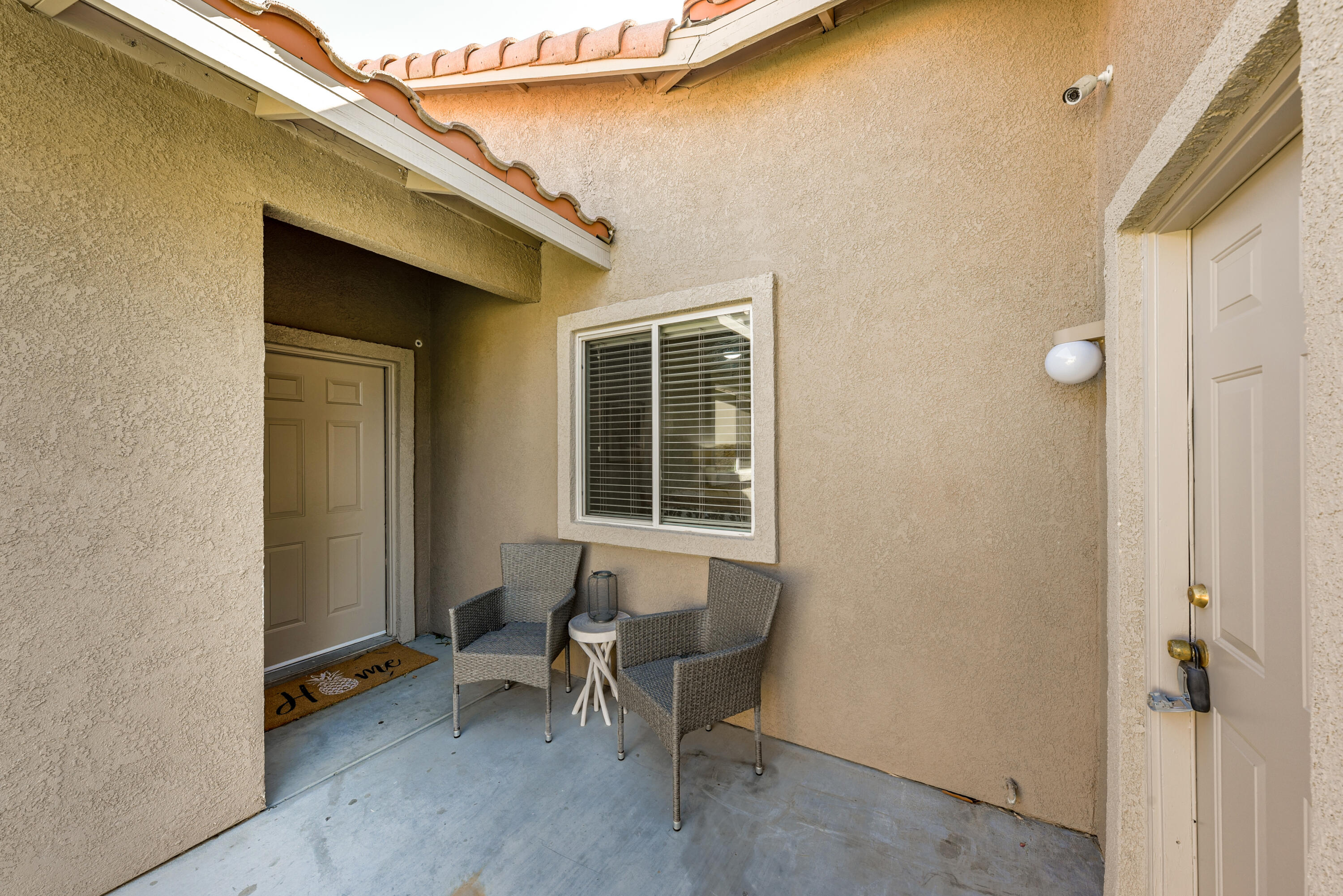 82346 Lancaster Way, Unit 125 Indio, CA 92201 - Photo 4 of 34 a backyard of a house with outdoor seating