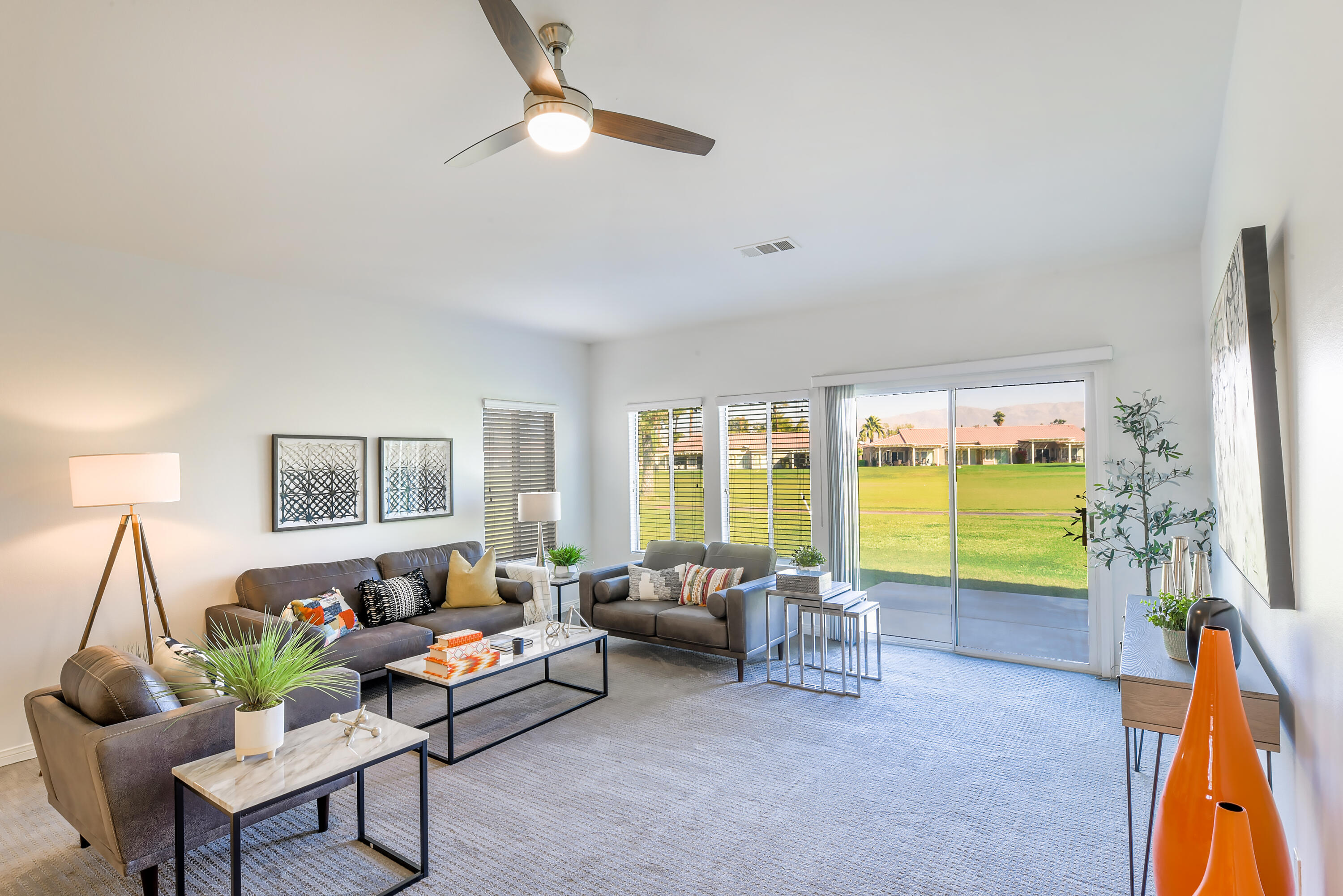 82346 Lancaster Way, Unit 125 Indio, CA 92201 - Photo 7 of 34 a living room with furniture and a flat screen tv
