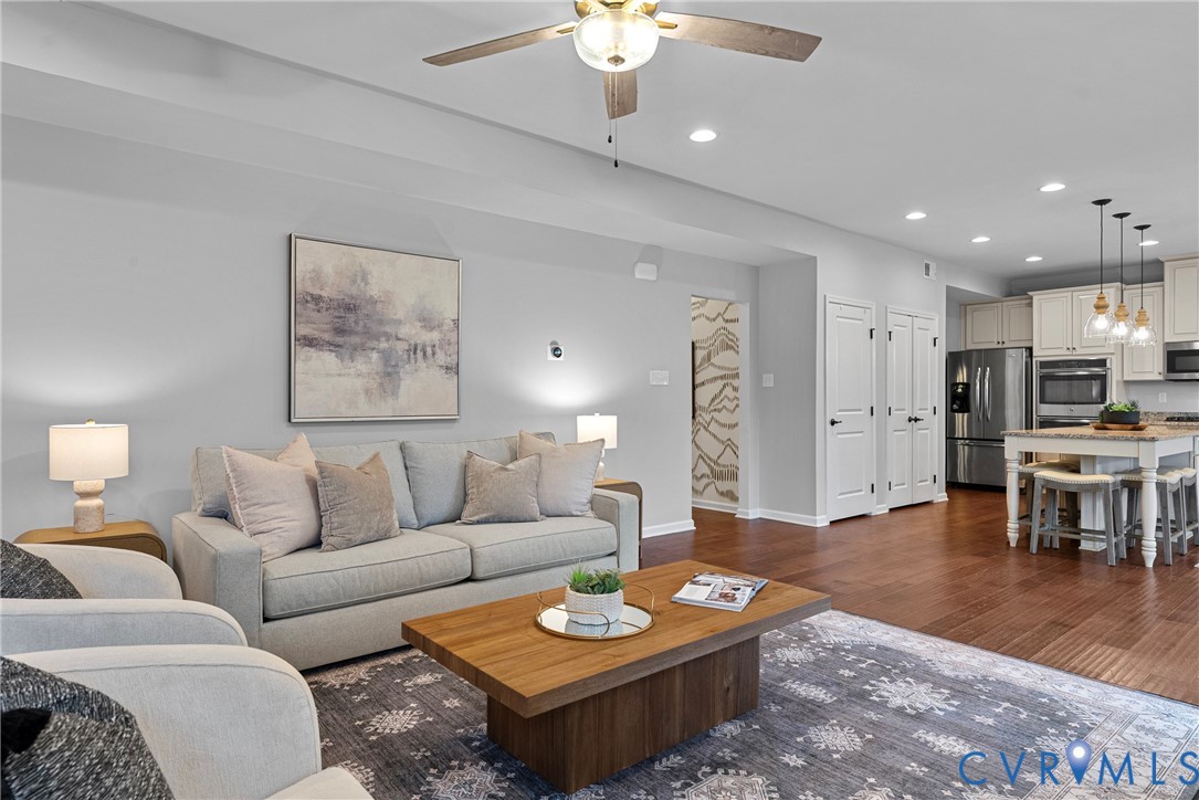 8316 Forge Road Henrico, VA 23228 - Photo 12 of 43 a living room with furniture kitchen view and a table