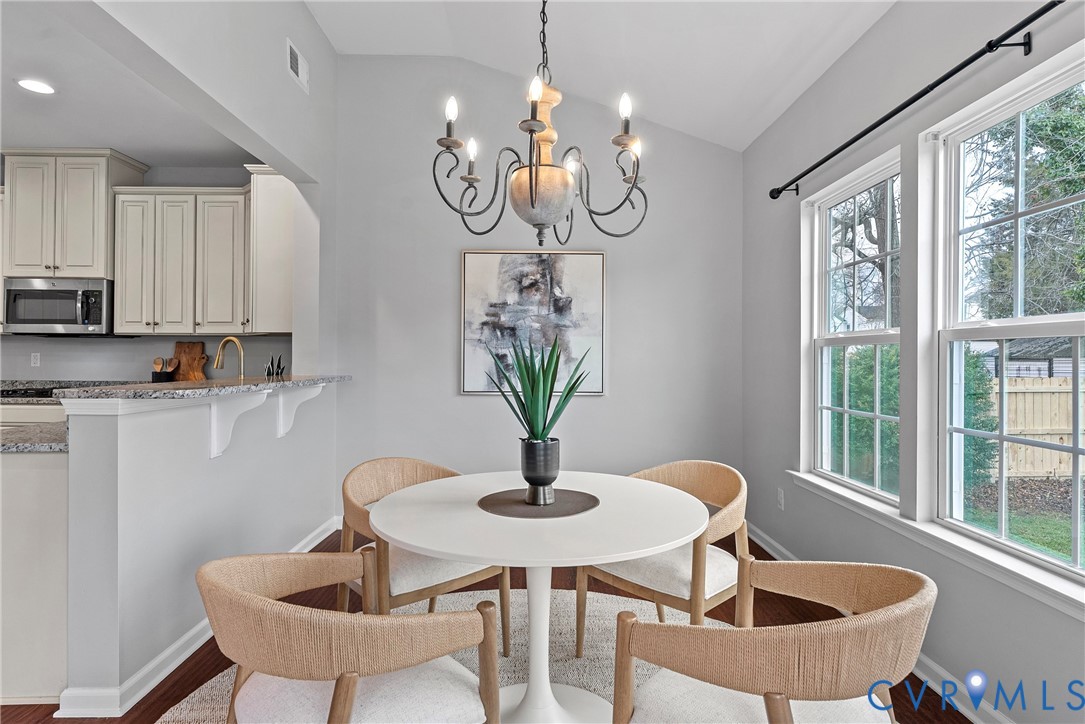 8316 Forge Road Henrico, VA 23228 - Photo 15 of 43 a view of a dining room with furniture window and outside view