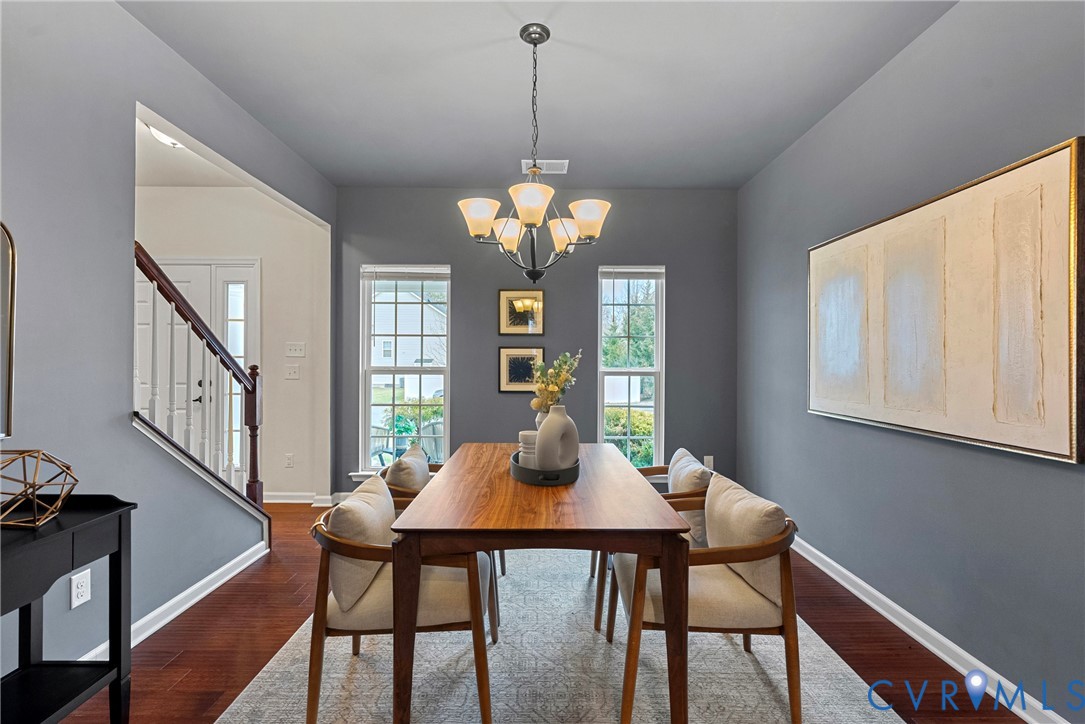 8316 Forge Road Henrico, VA 23228 - Photo 16 of 43 a view of a dining room with furniture window and wooden floor