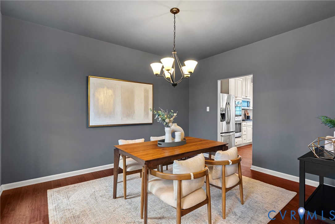 8316 Forge Road Henrico, VA 23228 - Photo 17 of 43 a dining room with a table and chairs