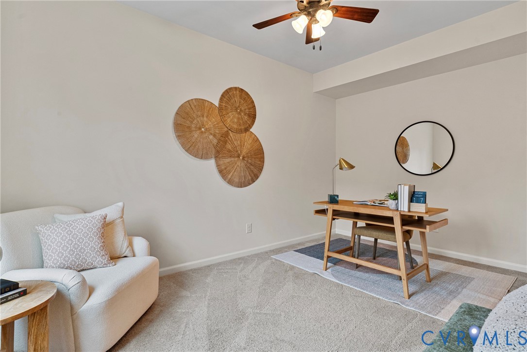 8316 Forge Road Henrico, VA 23228 - Photo 18 of 43 a living room with furniture a chandelier and a window