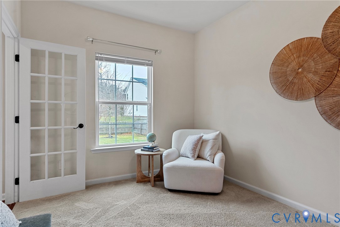 8316 Forge Road Henrico, VA 23228 - Photo 19 of 43 a living room with furniture and a window
