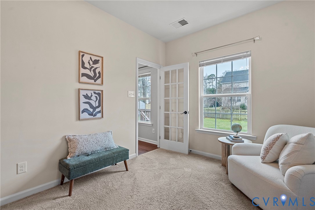 8316 Forge Road Henrico, VA 23228 - Photo 20 of 43 a living room with furniture and a large window