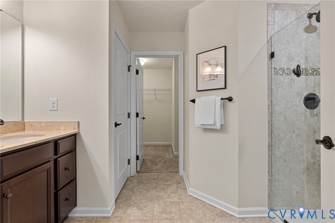 8316 Forge Road Henrico, VA 23228 - Photo 27 of 43 a bathroom with a sink and mirror