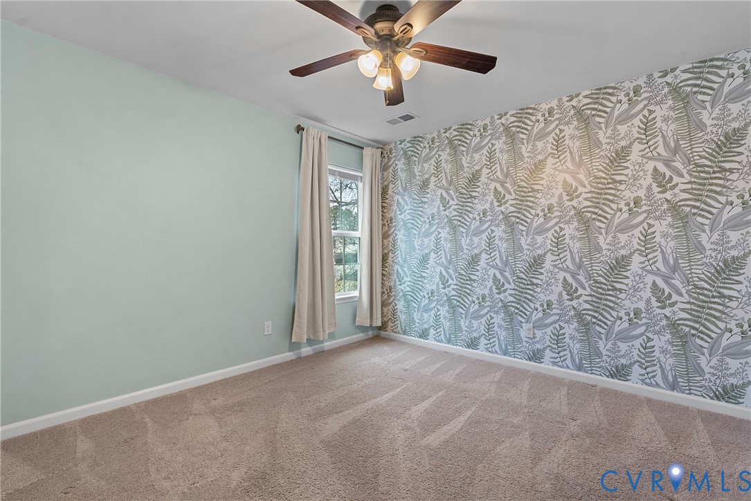 8316 Forge Road Henrico, VA 23228 - Photo 30 of 43 a view of a livingroom with a ceiling fan and window