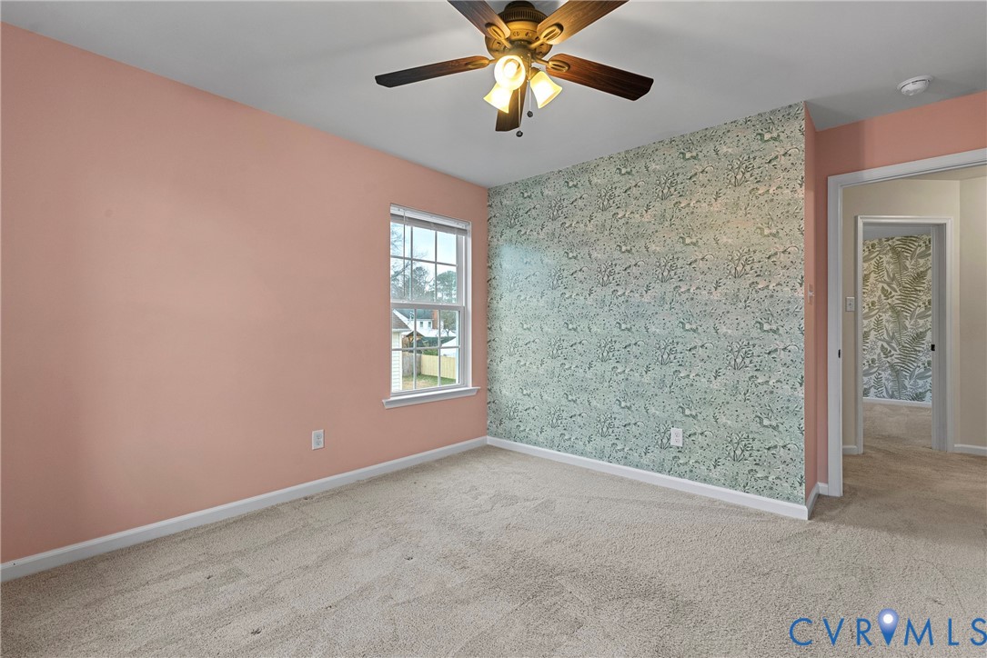 8316 Forge Road Henrico, VA 23228 - Photo 32 of 43 an empty room with windows and fan