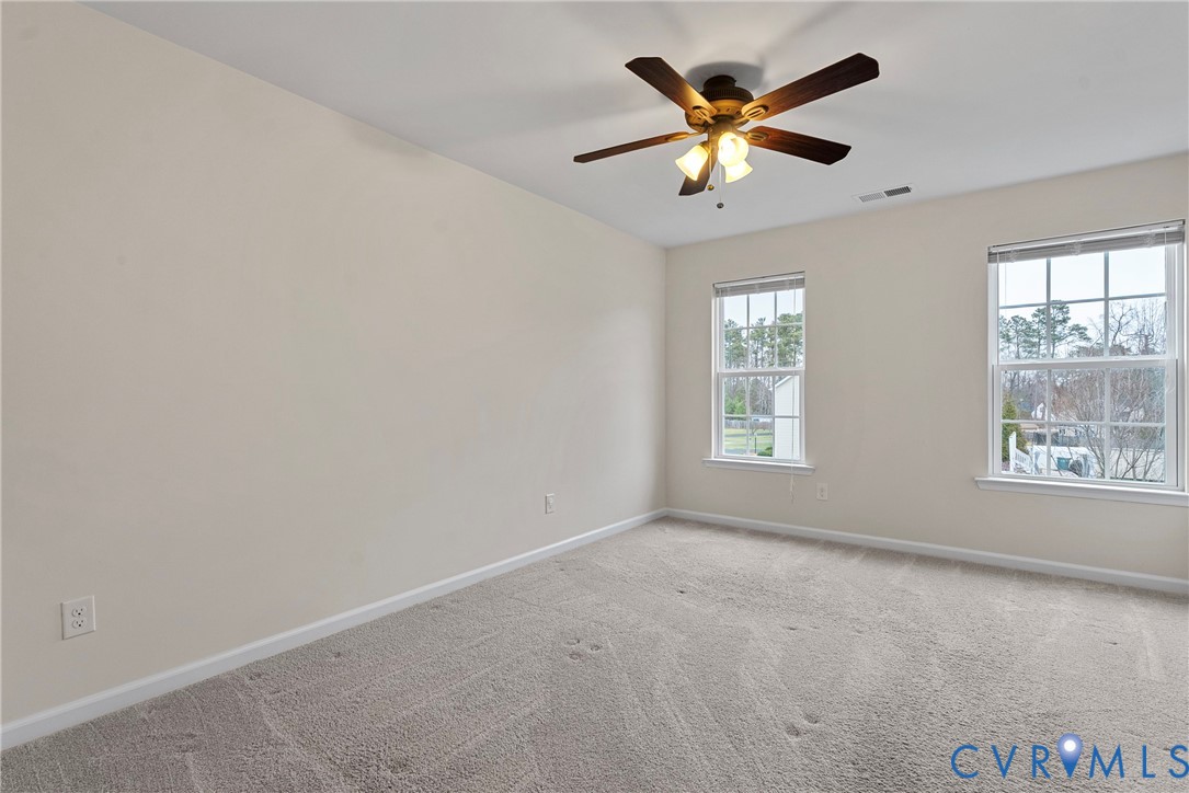 8316 Forge Road Henrico, VA 23228 - Photo 36 of 43 an empty room with ceiling fan and window