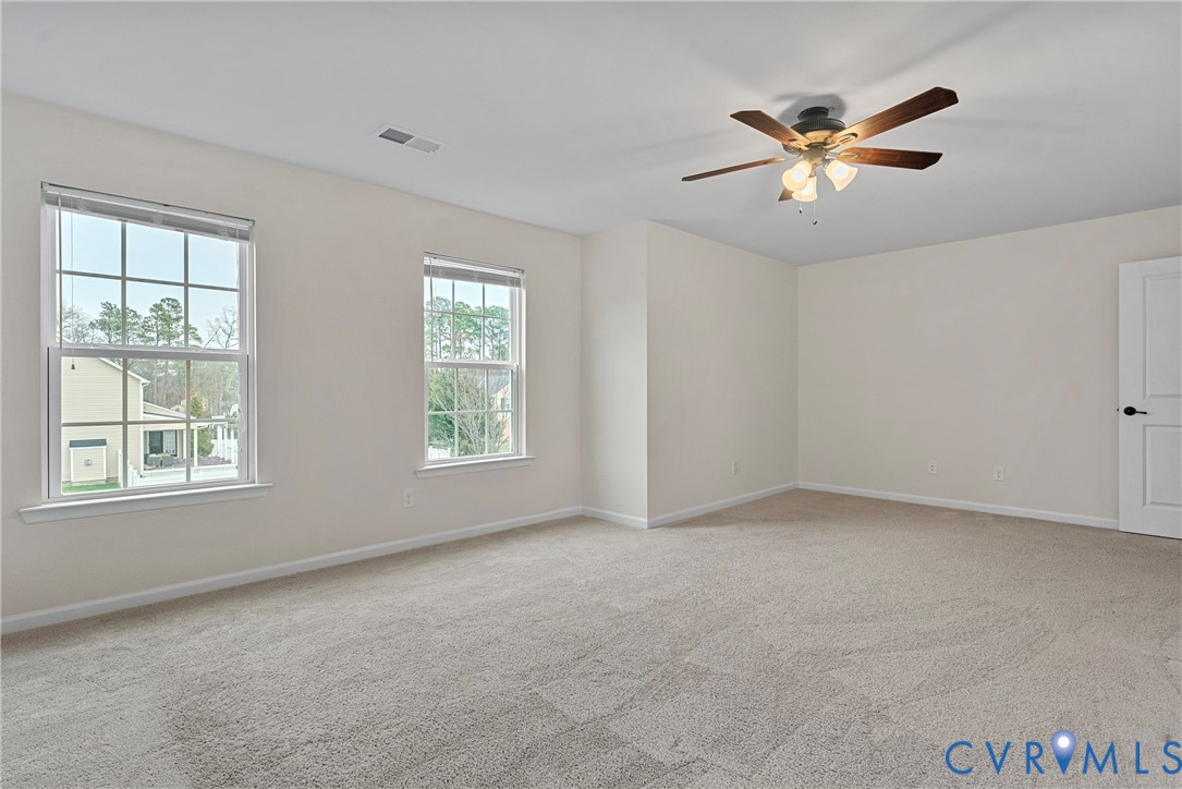 8316 Forge Road Henrico, VA 23228 - Photo 38 of 43 an empty room with windows and fan