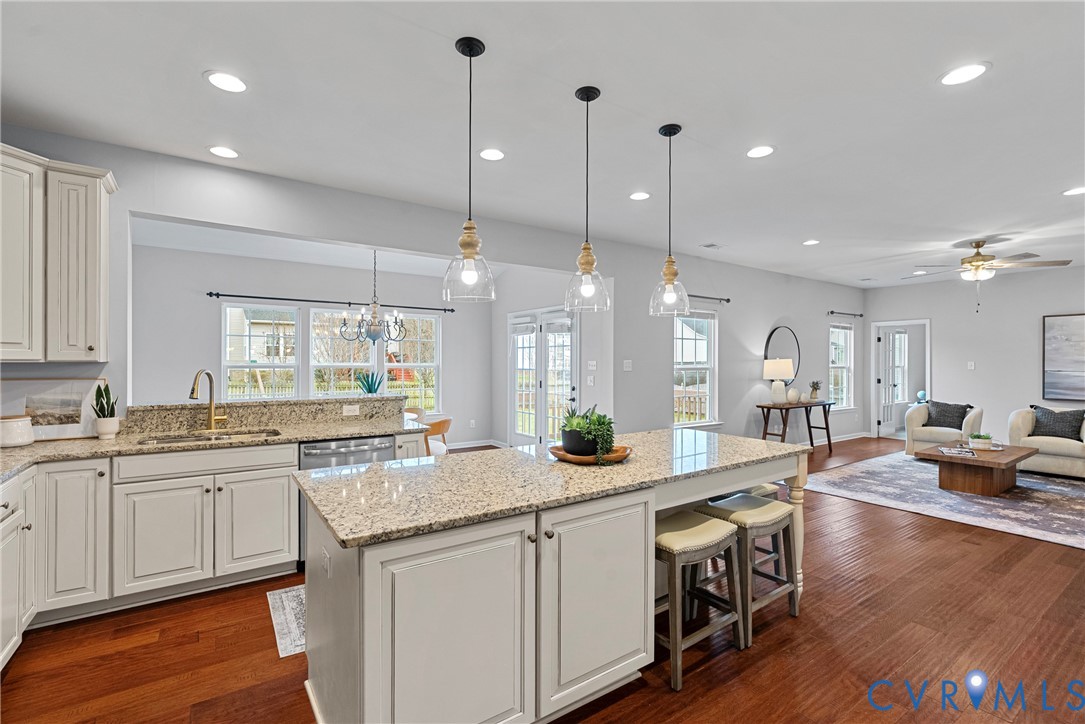 8316 Forge Road Henrico, VA 23228 - Photo 4 of 43 a large kitchen with kitchen island granite countertop a large center island attached withe living room