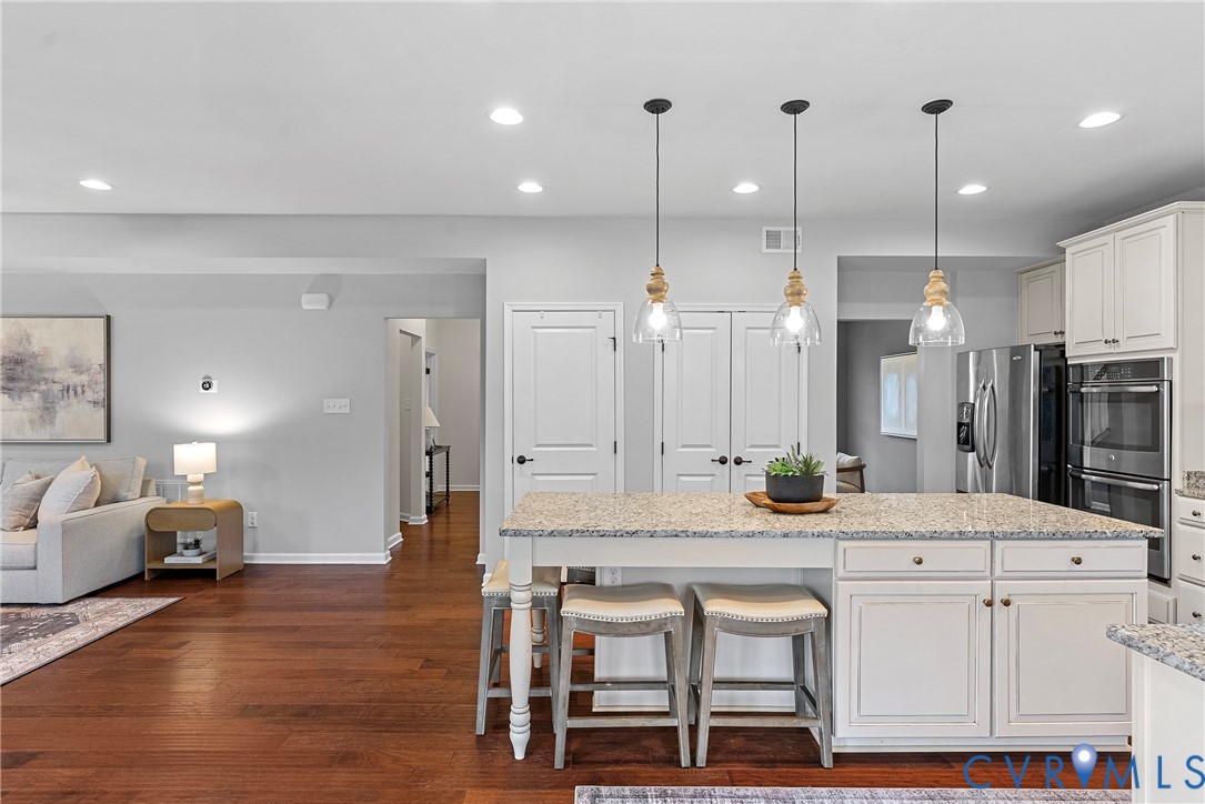 8316 Forge Road Henrico, VA 23228 - Photo 8 of 43 a large kitchen with a table and chairs