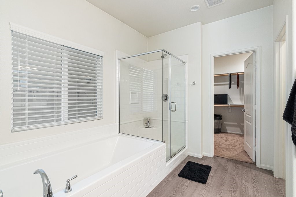 35851 Esperia Way Fallbrook, CA 92028 - Photo 12 of 28 a bathroom with a bathtub and a shower