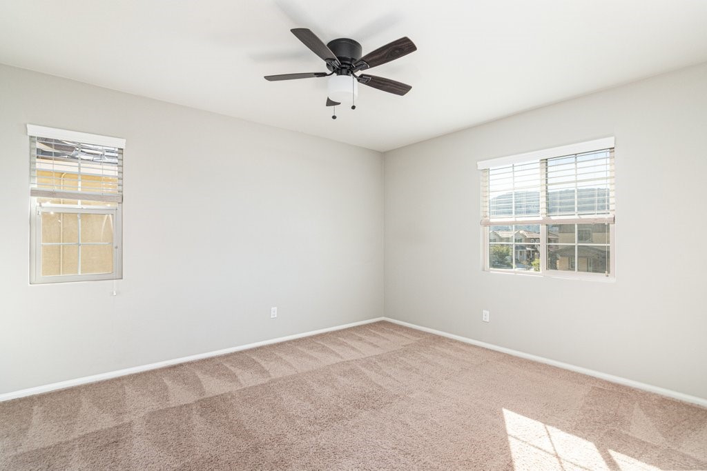 35851 Esperia Way Fallbrook, CA 92028 - Photo 19 of 28 an empty room with window and a ceiling fan